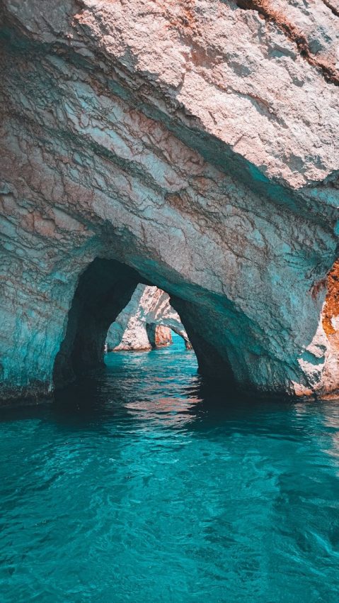 a large rock formation in the middle of a body of water Zante Zakinthos