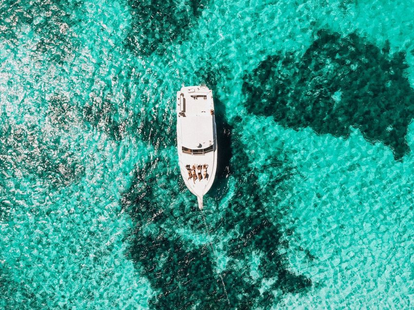 white yacht on body of water, Roatan