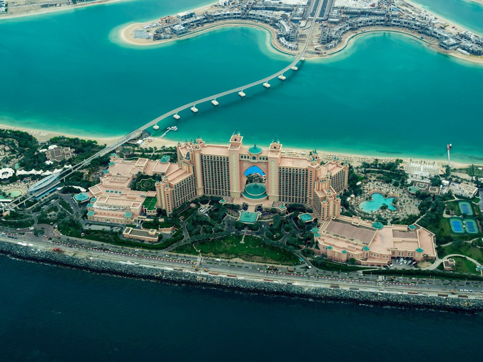 aerial photography of concrete buildings on the middle of the sea, Dubai