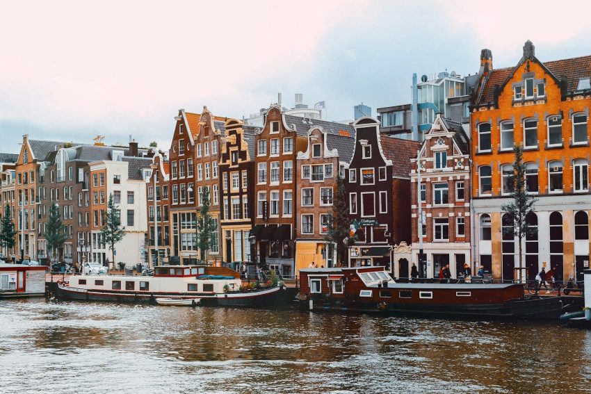 a group of boats that are sitting in the water, Amsterdam, Netherlands