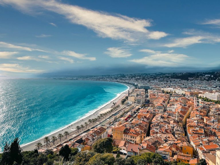 an aerial view of a city next to the ocean, Nice, France