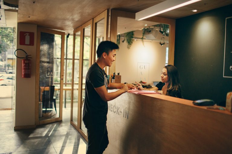 A man checking in to a hotel