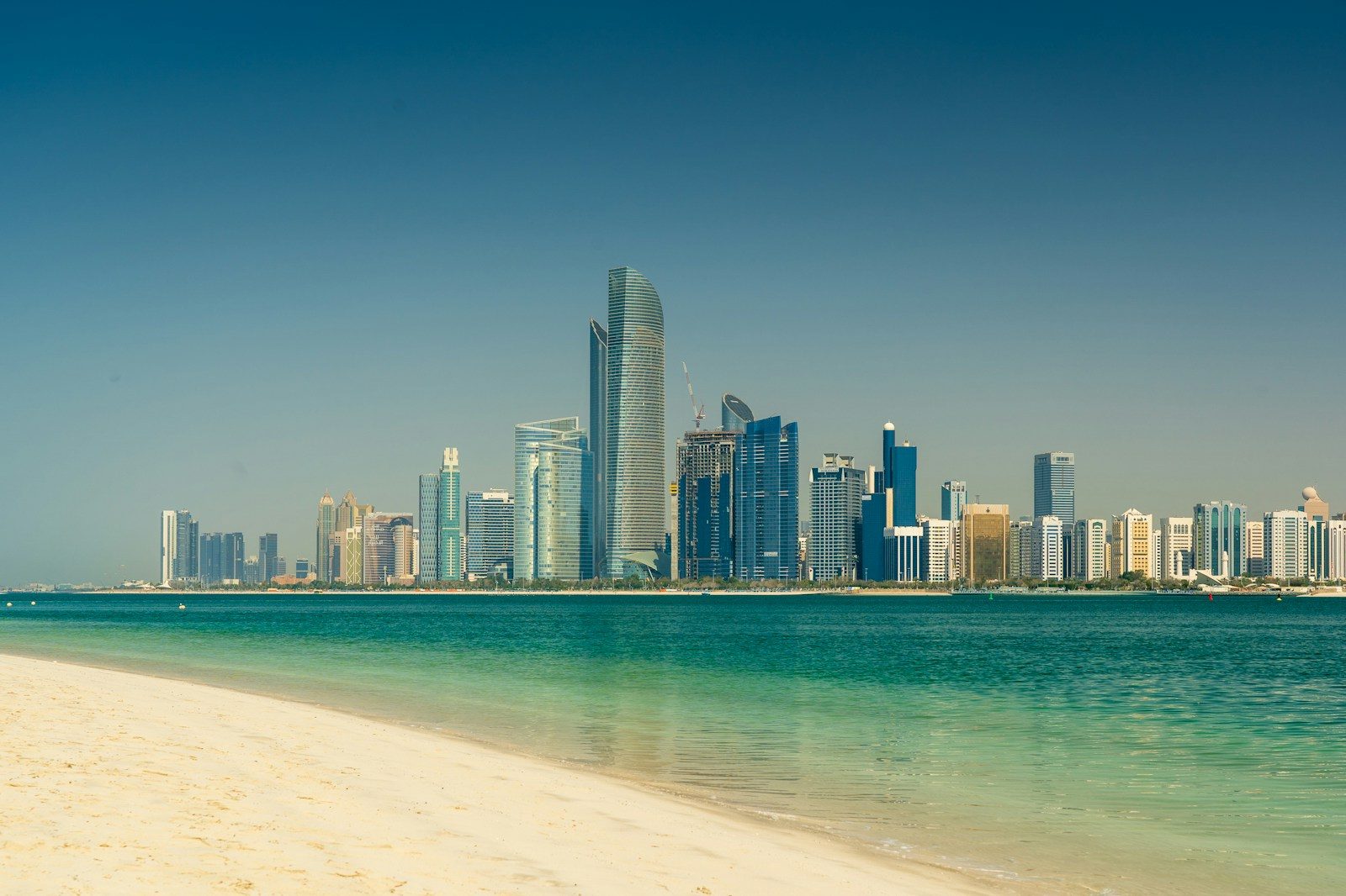 city skyline across the sea during daytime