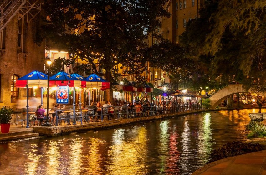 a river runs through a city at night